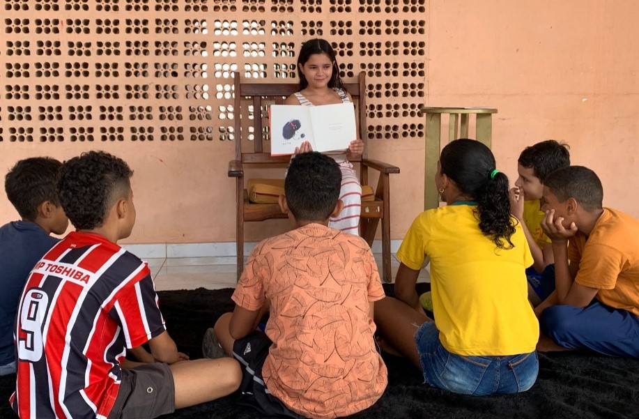 a man teaching a group of children