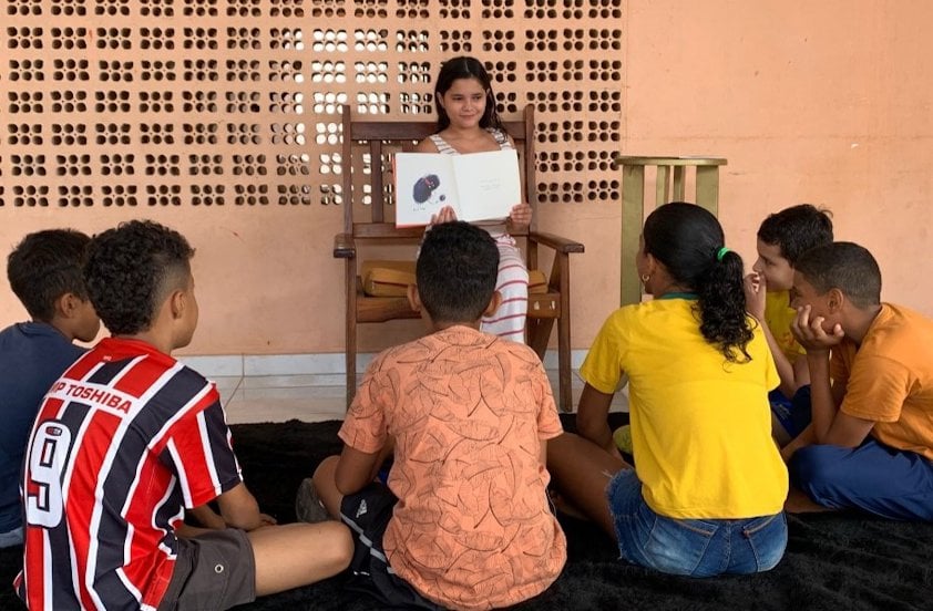 a man teaching a group of children