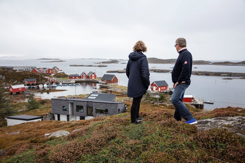 Architect Tone Sandøy and her father take in the view and their holiday home on Sandøya