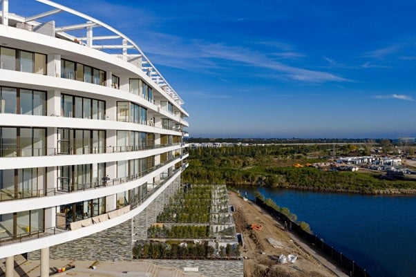 a building with a body of water in the front