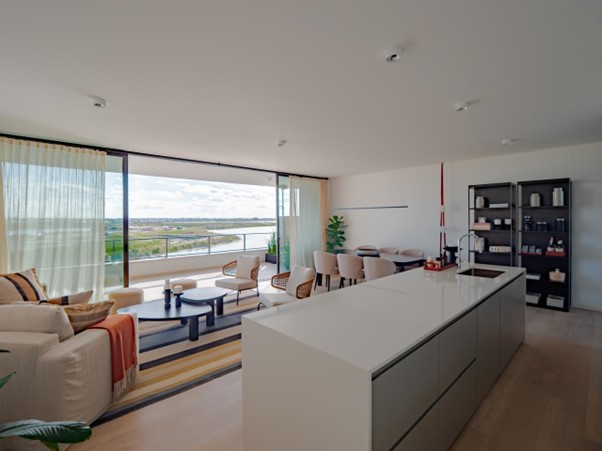 a modern looking living room with a large window