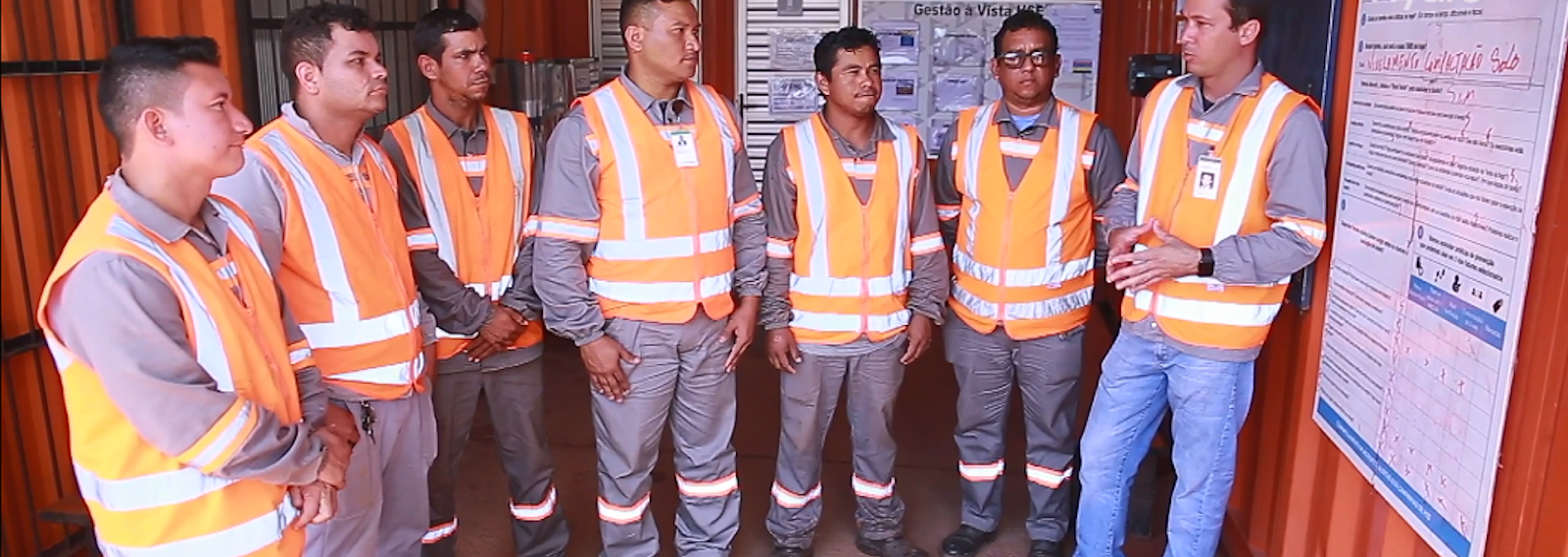 group of workers in relflective vests