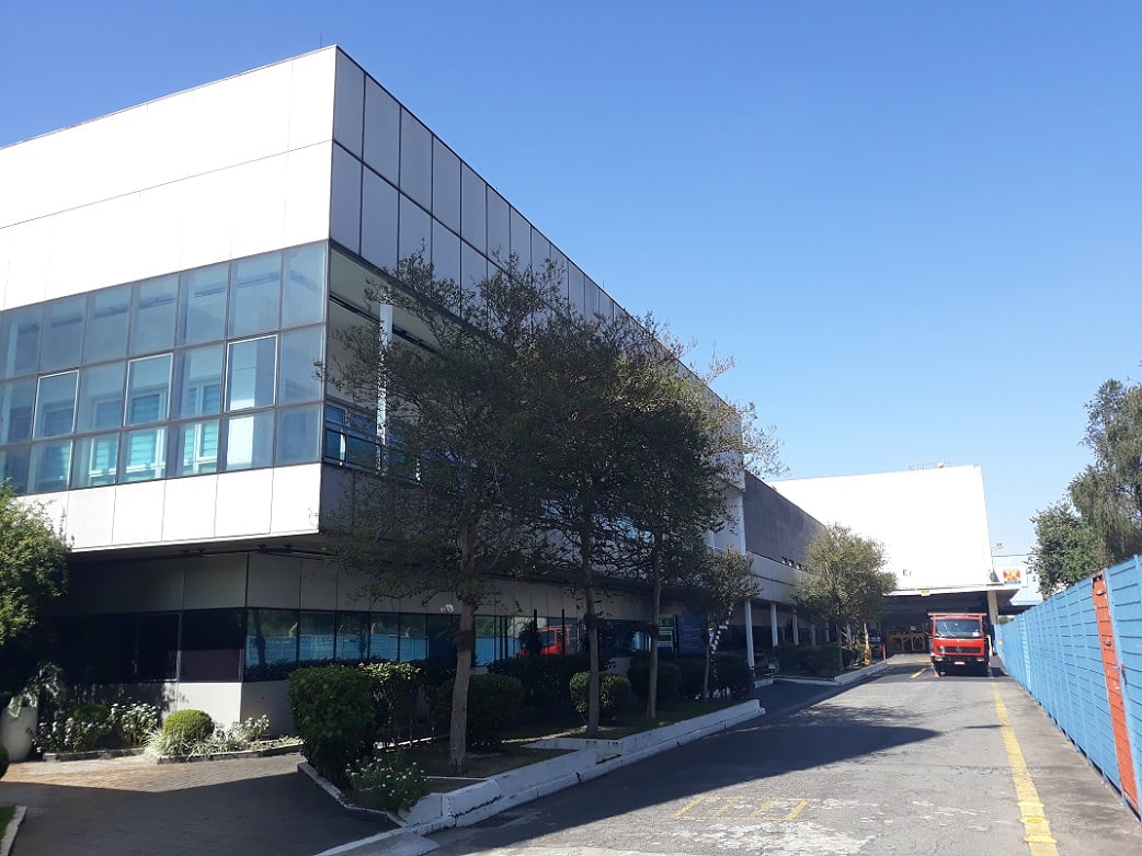 a building with a blue fence