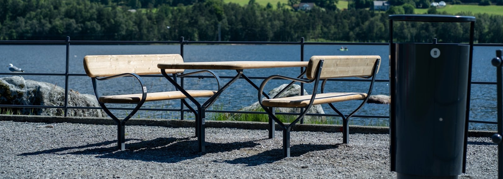 a picnic table and bench on a beach