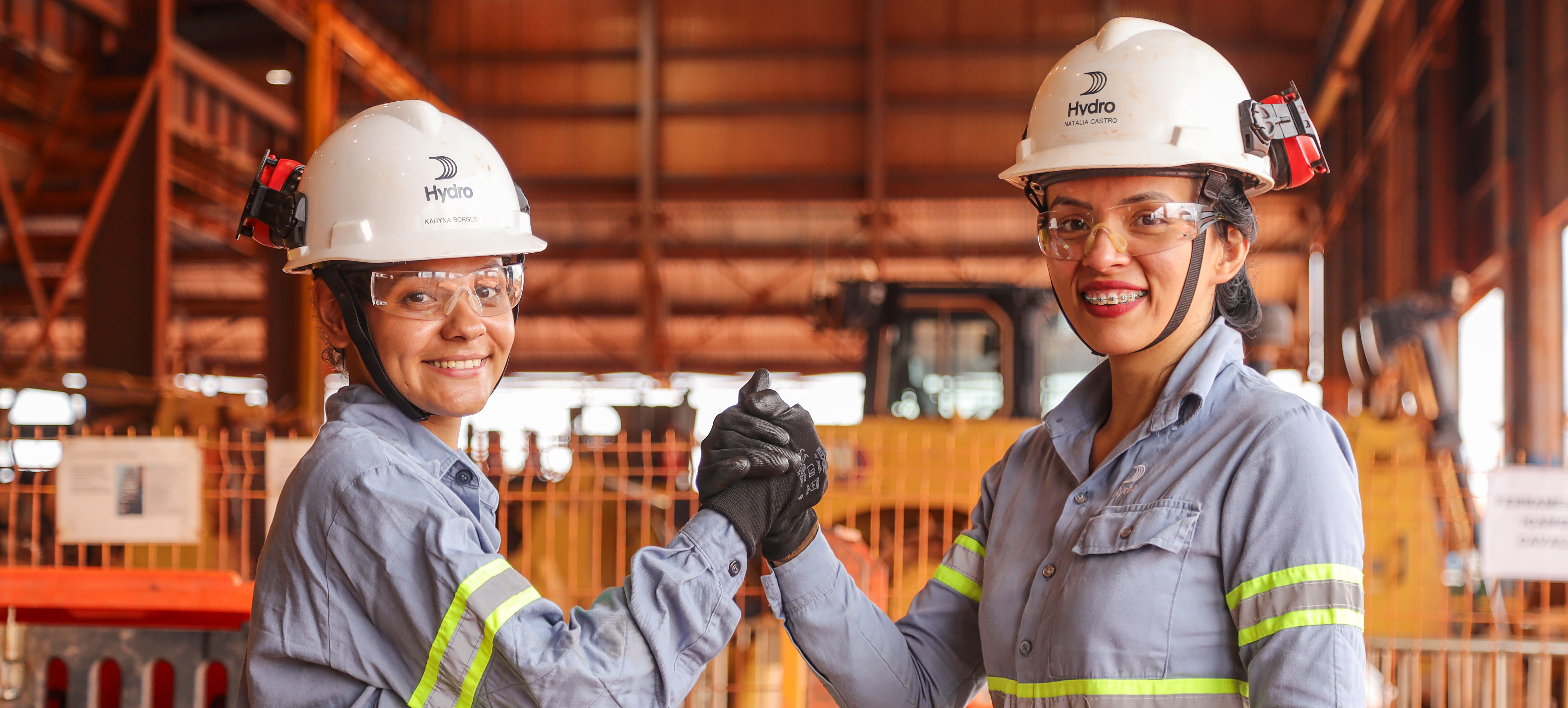 a few people wearing hard hats