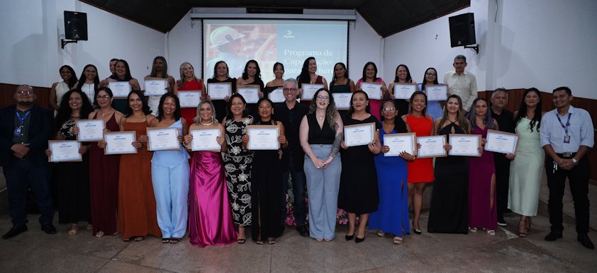 a group of women holding certificates