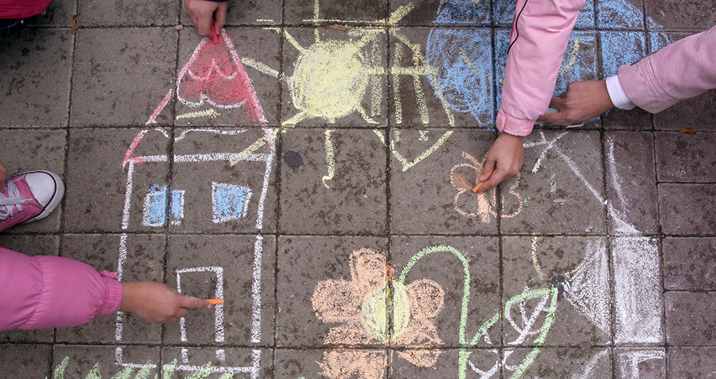 children sketching in chalk