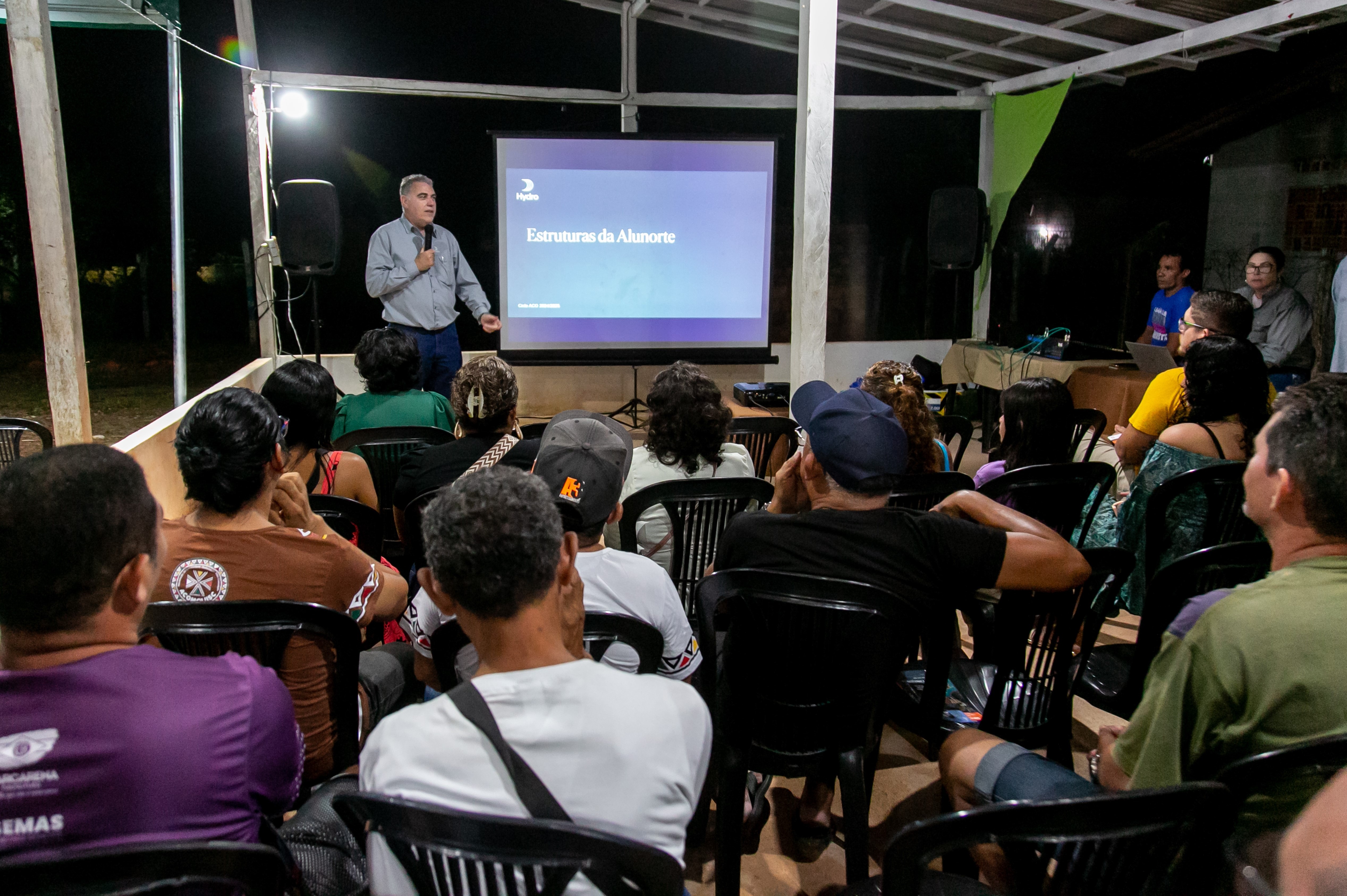 a man giving a presentation to a group of people