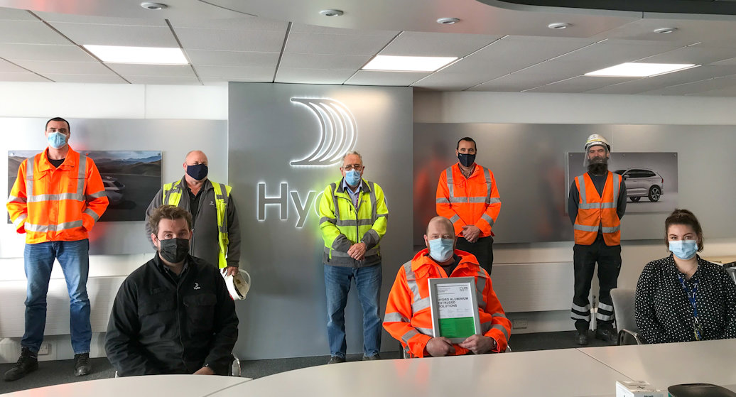 Employees at Hydro's Gloucester plant with social distance due to Covid19