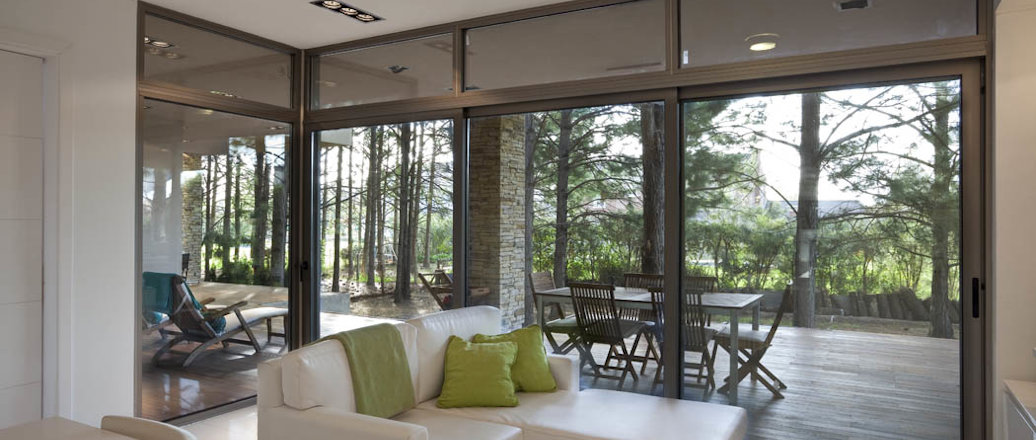 a living room with a large glass door