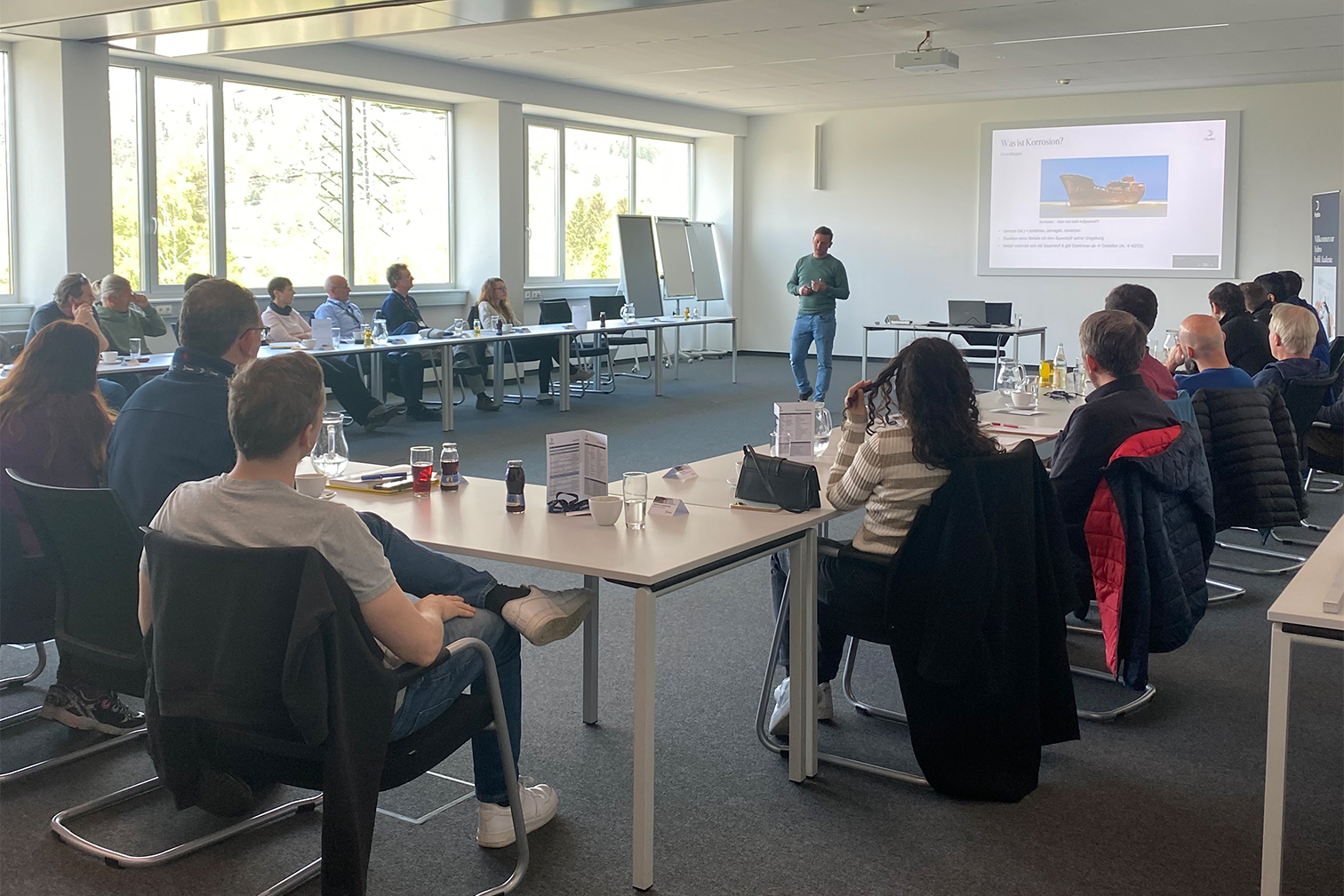 a group of people sitting around a table