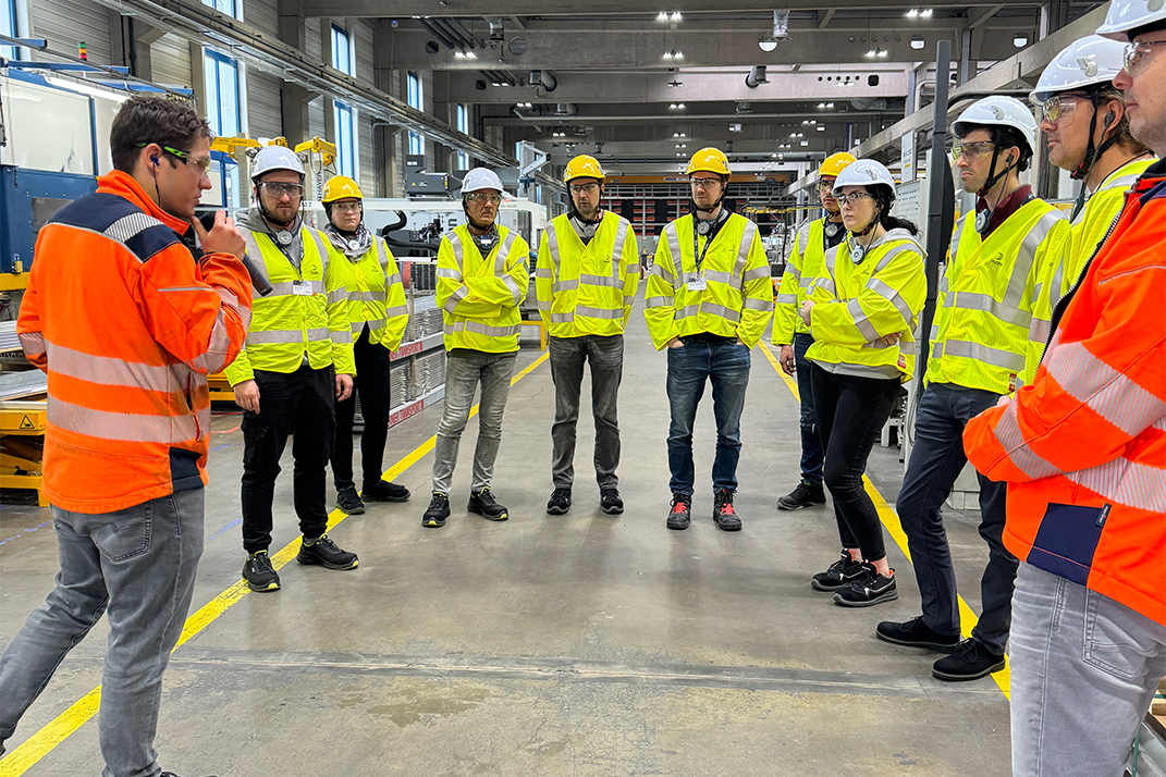 a group of people wearing safety vests