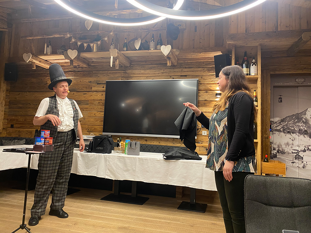 a man and woman standing in front of a television