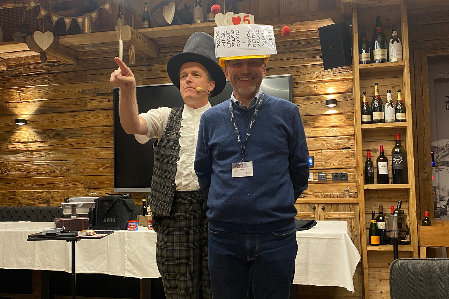 two men wearing hats