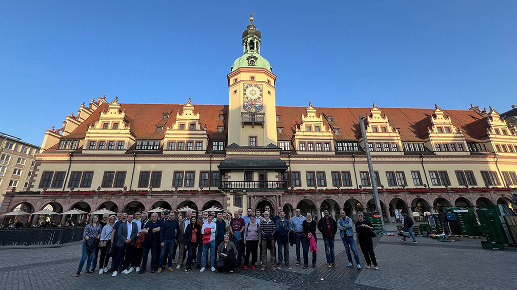 a group of people standing in front of a building