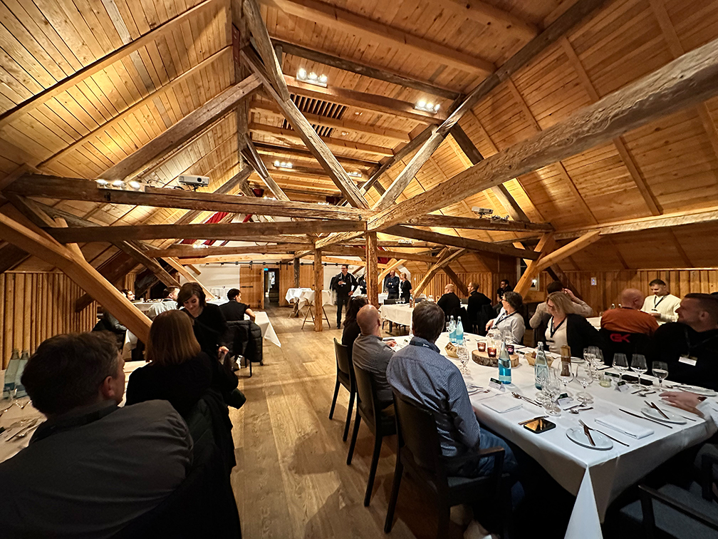 a group of people sitting at tables