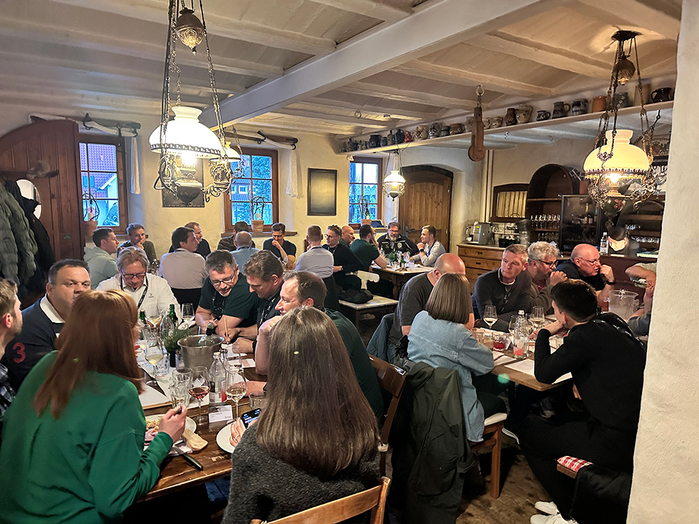 a large group of people sitting at tables