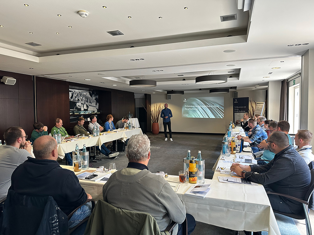 a group of people sitting at tables
