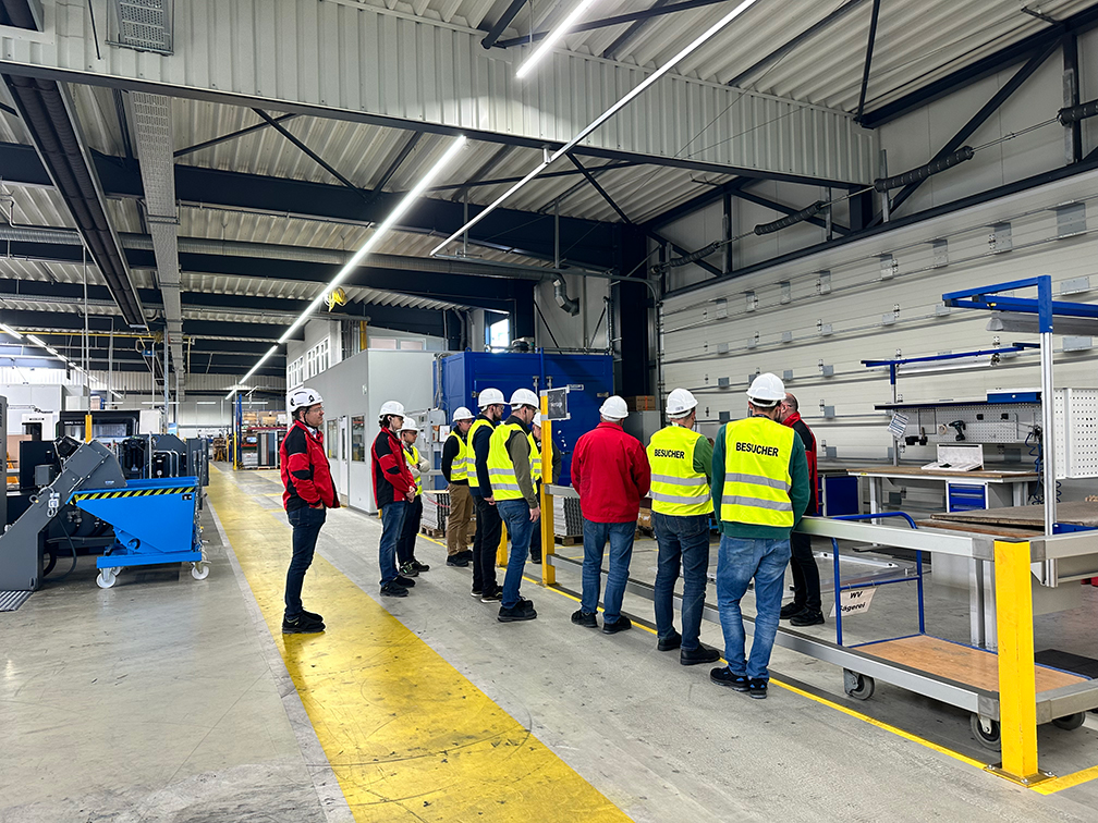 a group of people wearing safety vests