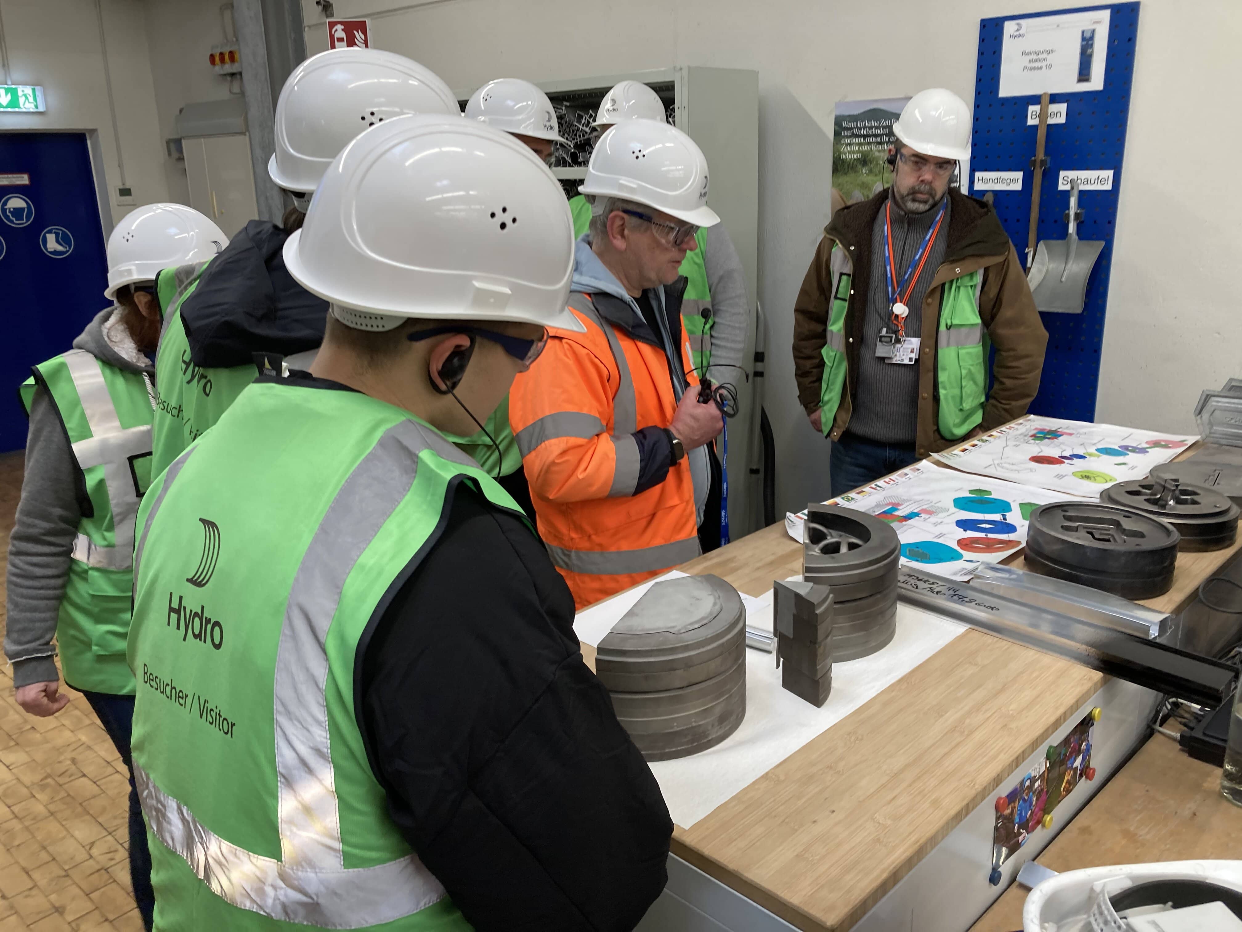 a group of people wearing hard hats