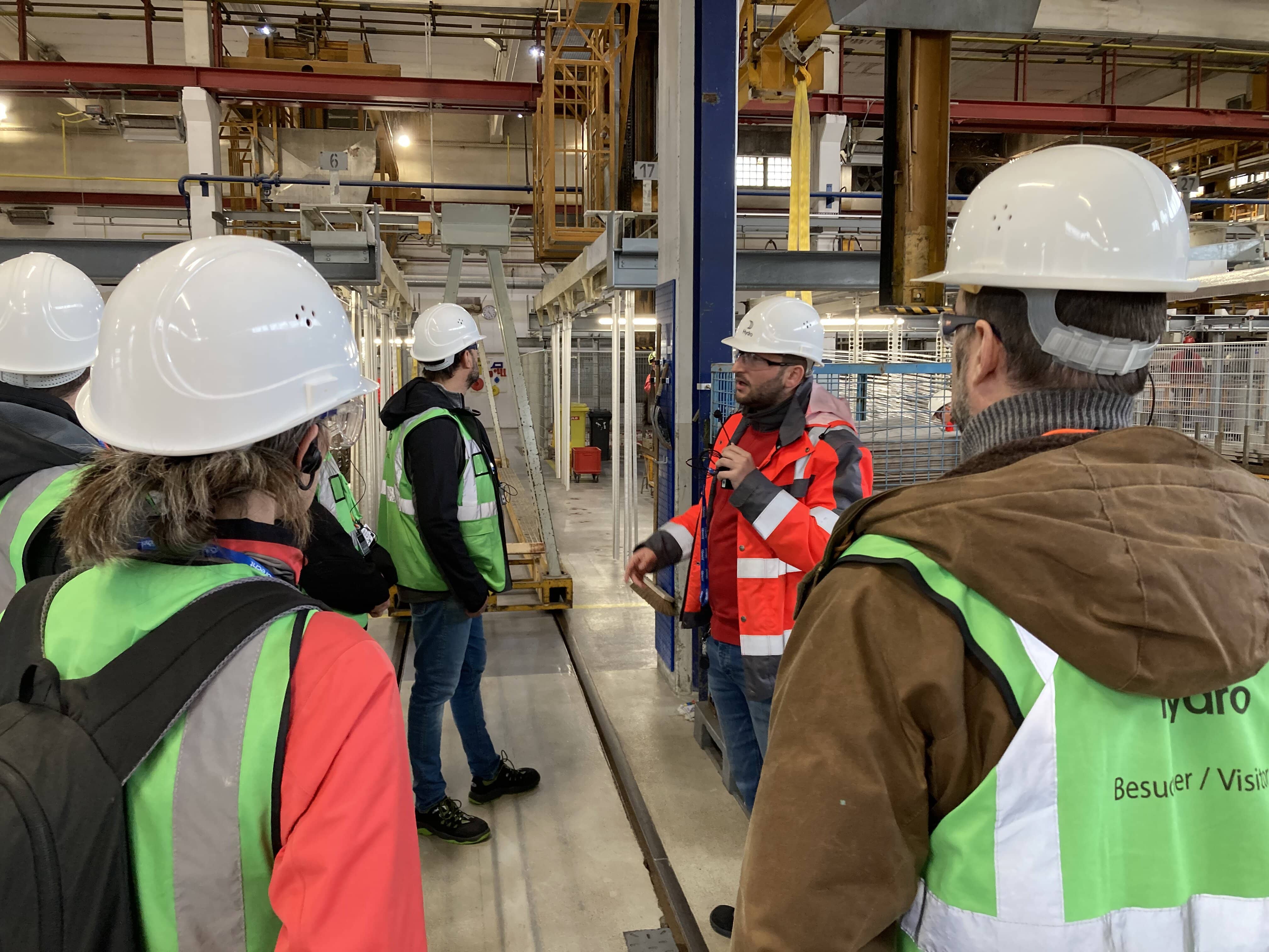 a group of people wearing hardhats and reflectors
