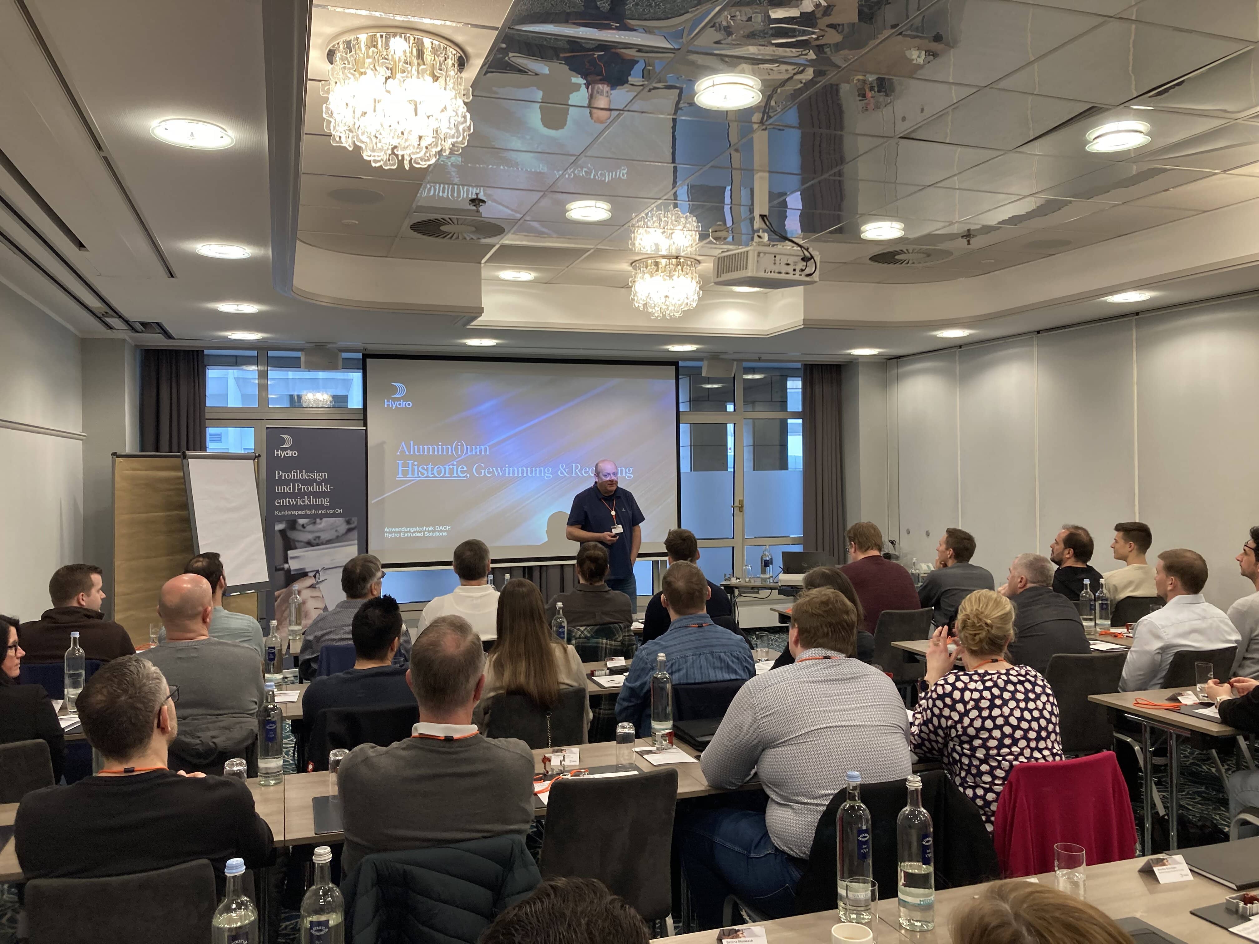 a person giving a presentation to an audience