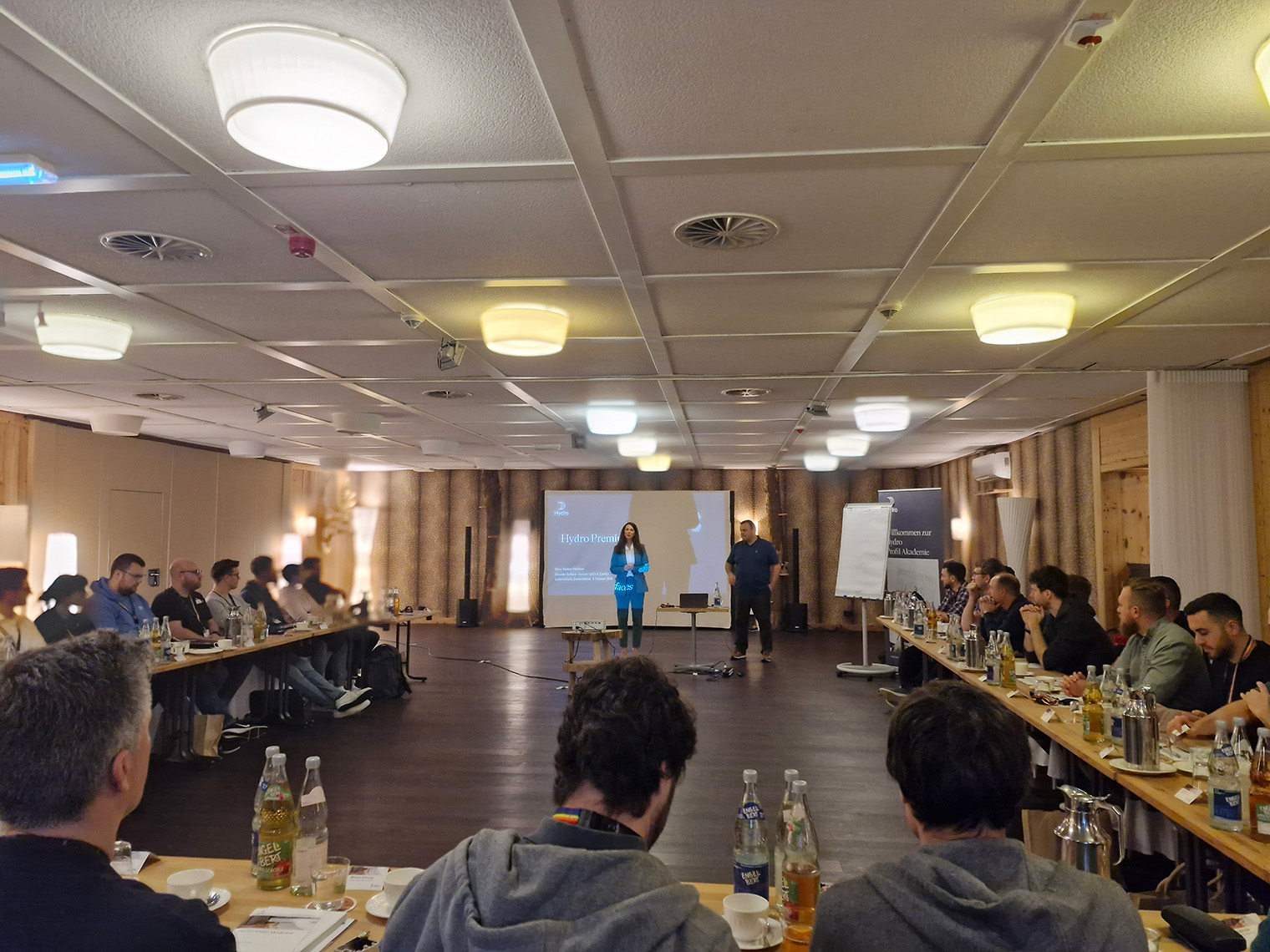 a group of people sitting at tables