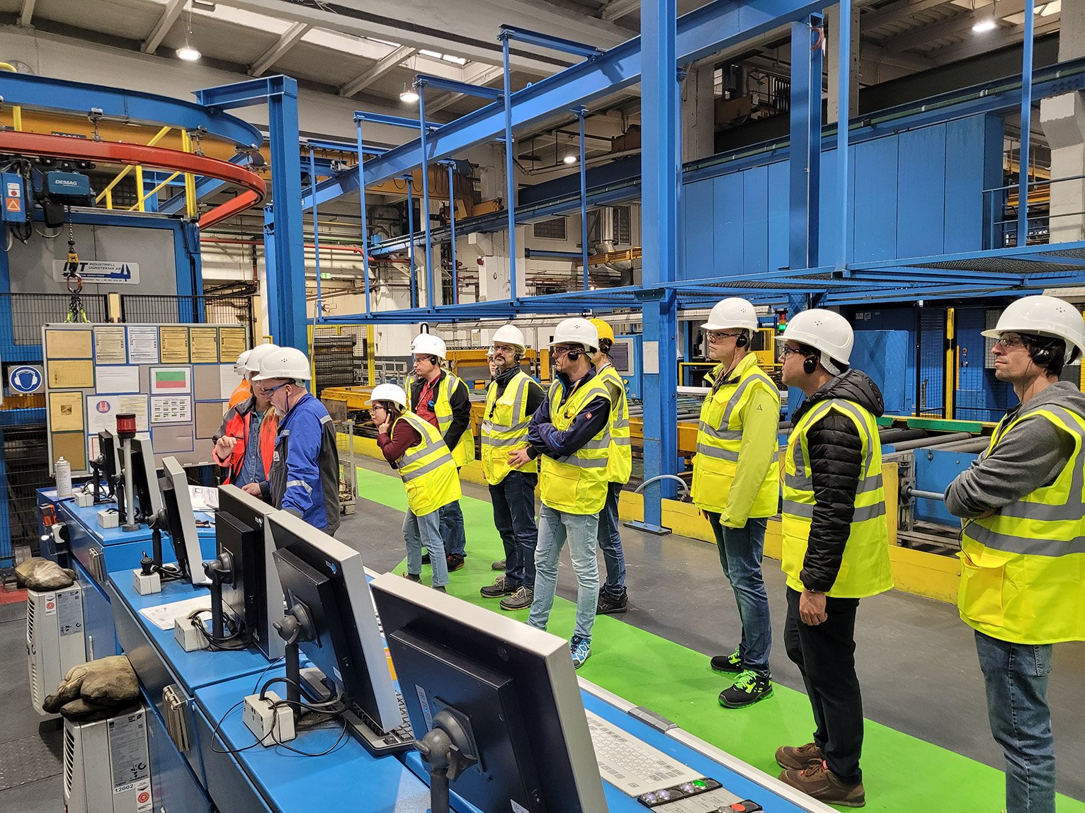 a group of people wearing safety vests