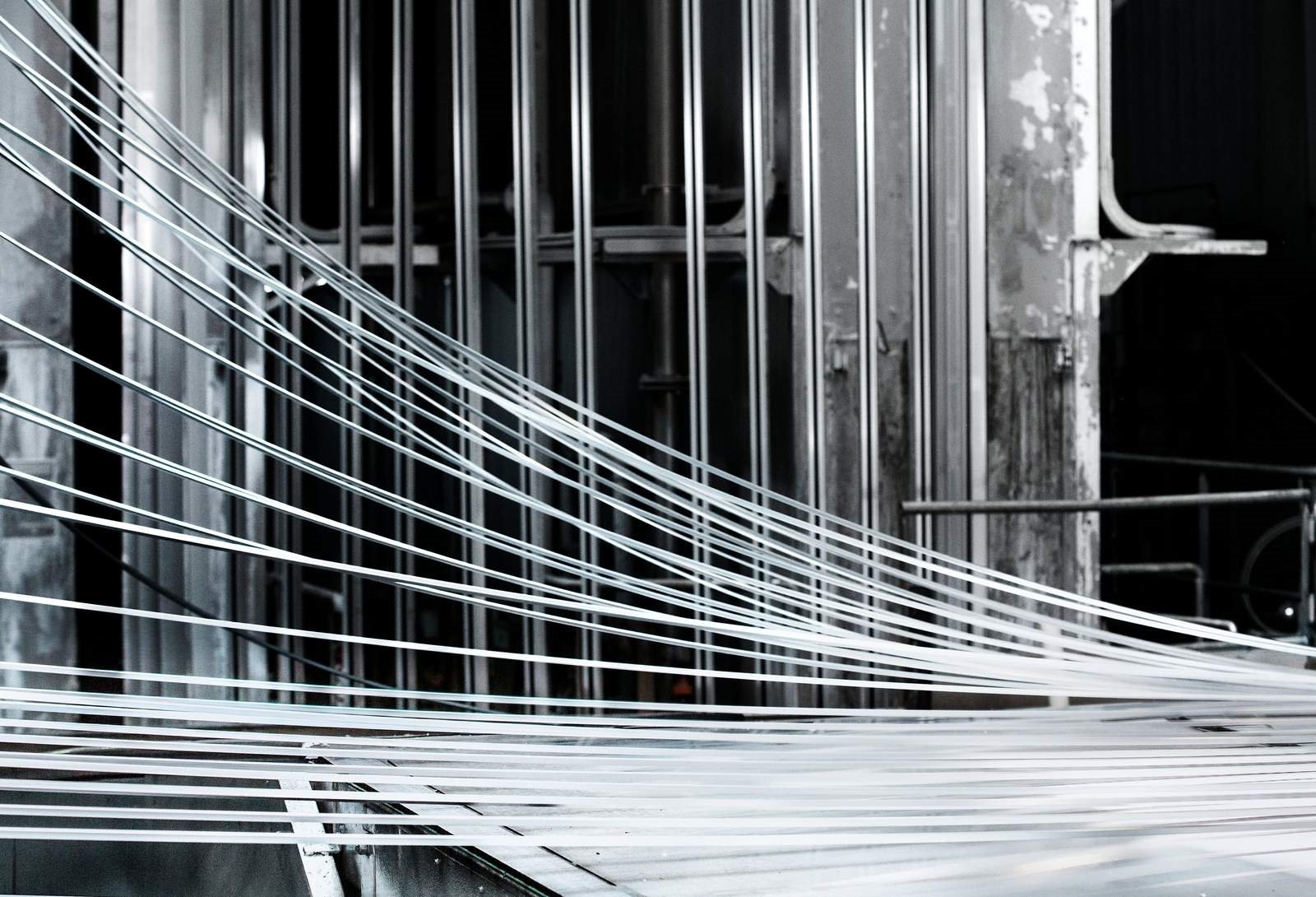 Lengths of aluminum emerging from a paint line