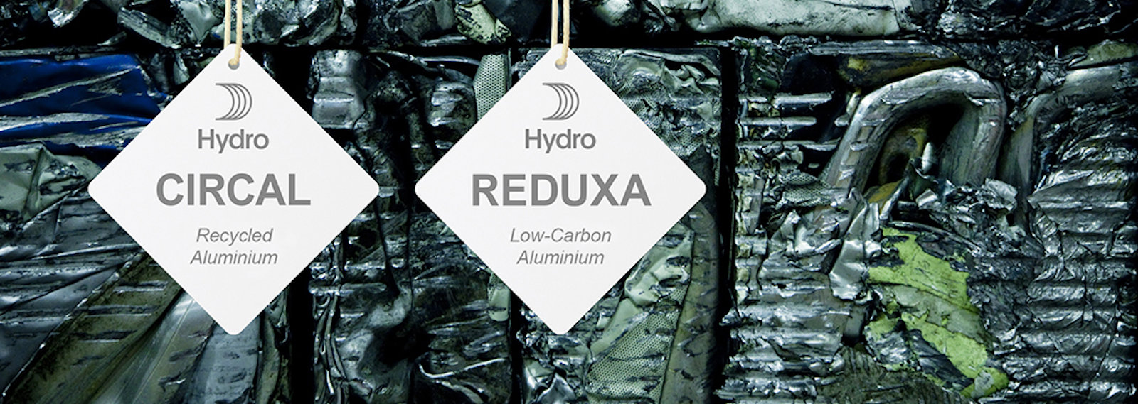 Hydro CIRCAL and Hydro REDUXA hangtags hanging on aluminium scrap