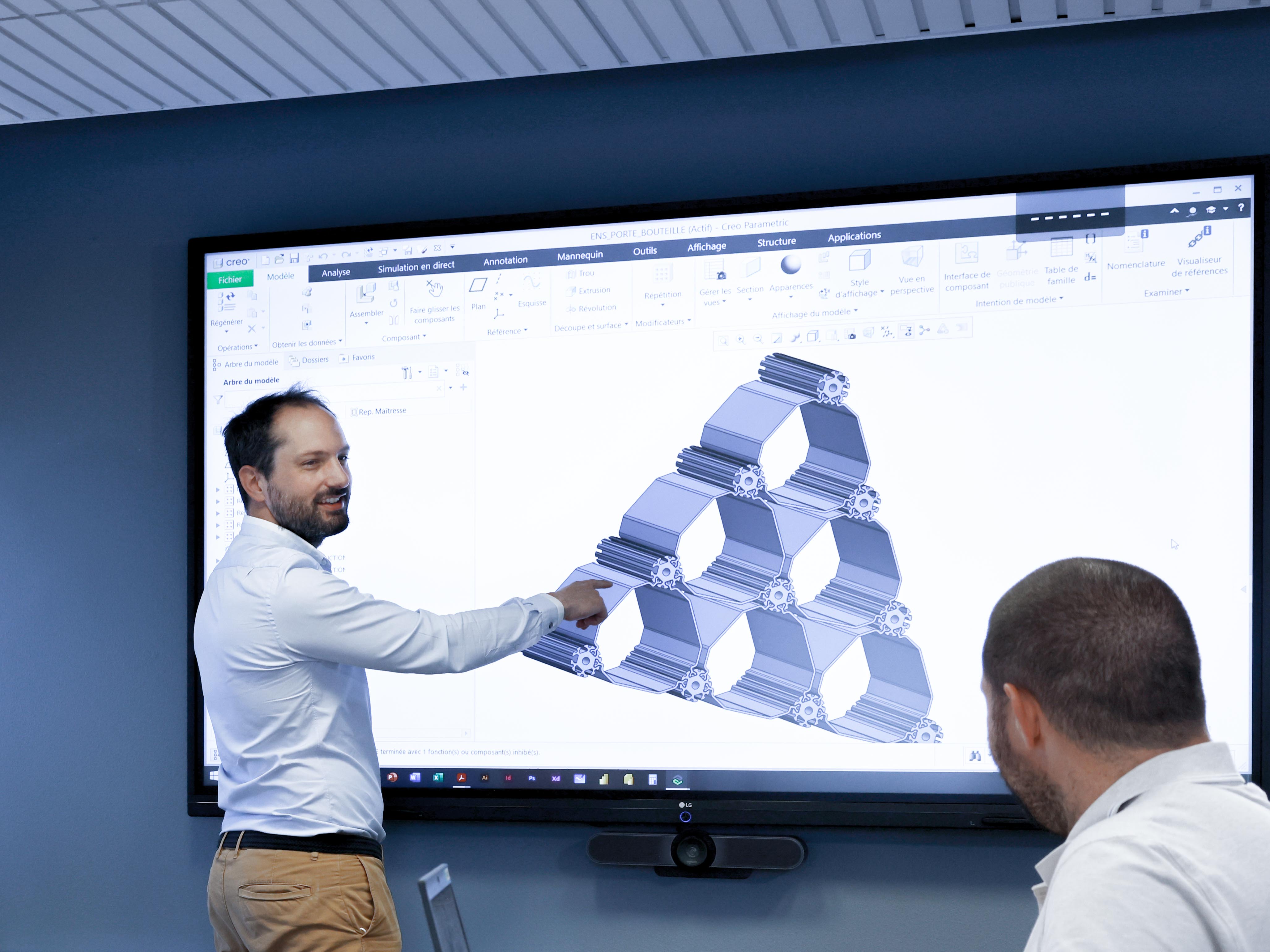 a man pointing at a screen