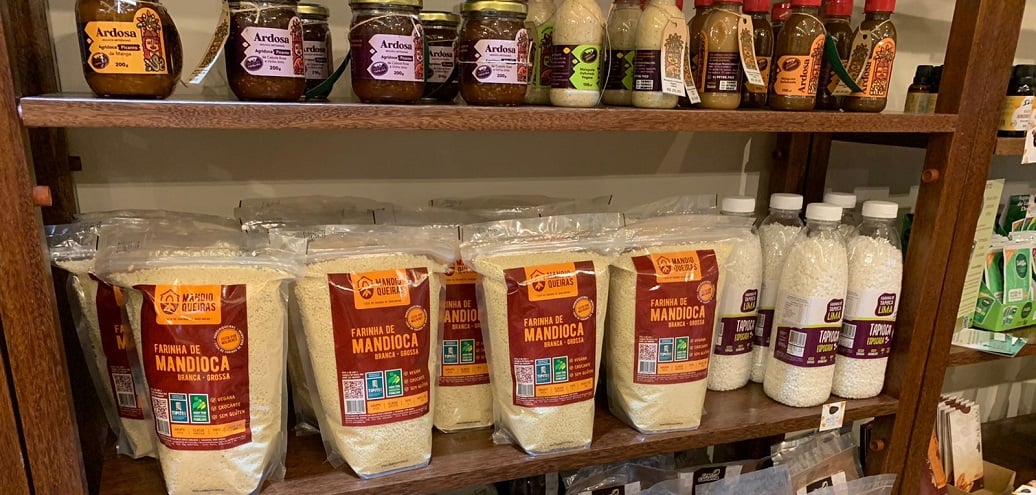 a shelf with many jars of food on it