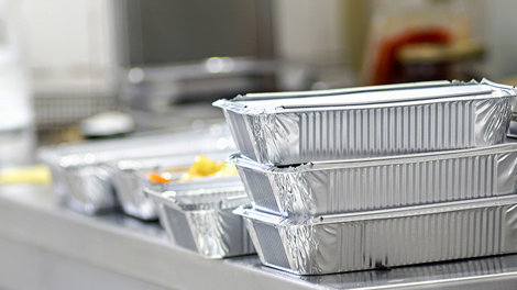 Take away food in foil boxes in Chinese restaurant kitchen
