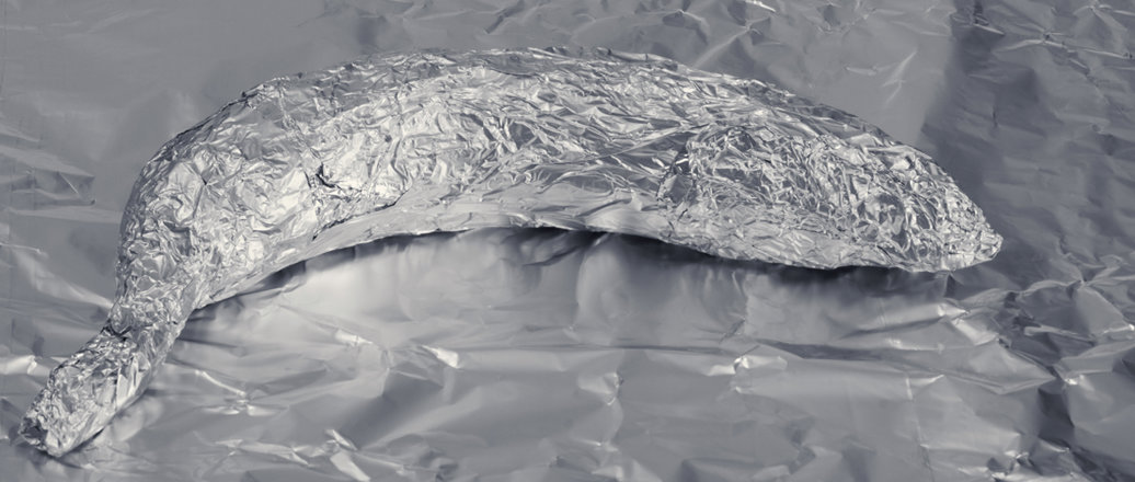 A fish wrapped in aluminum foil