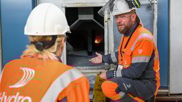 a few people wearing hard hats