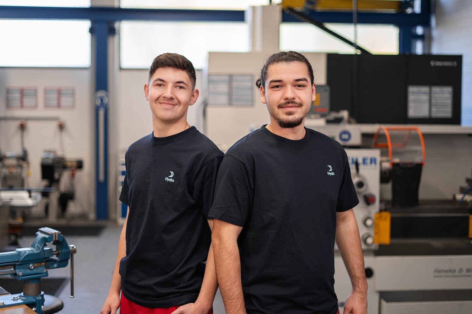 two men standing in a room