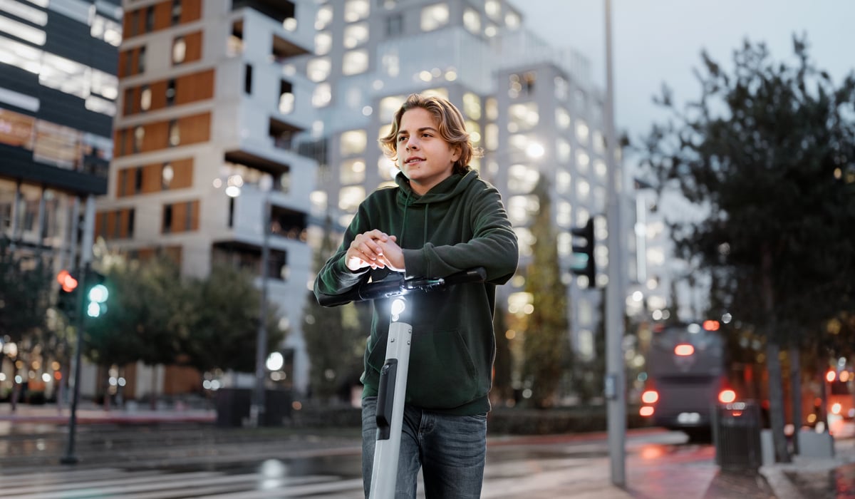 Young guy on a scooter in the city
