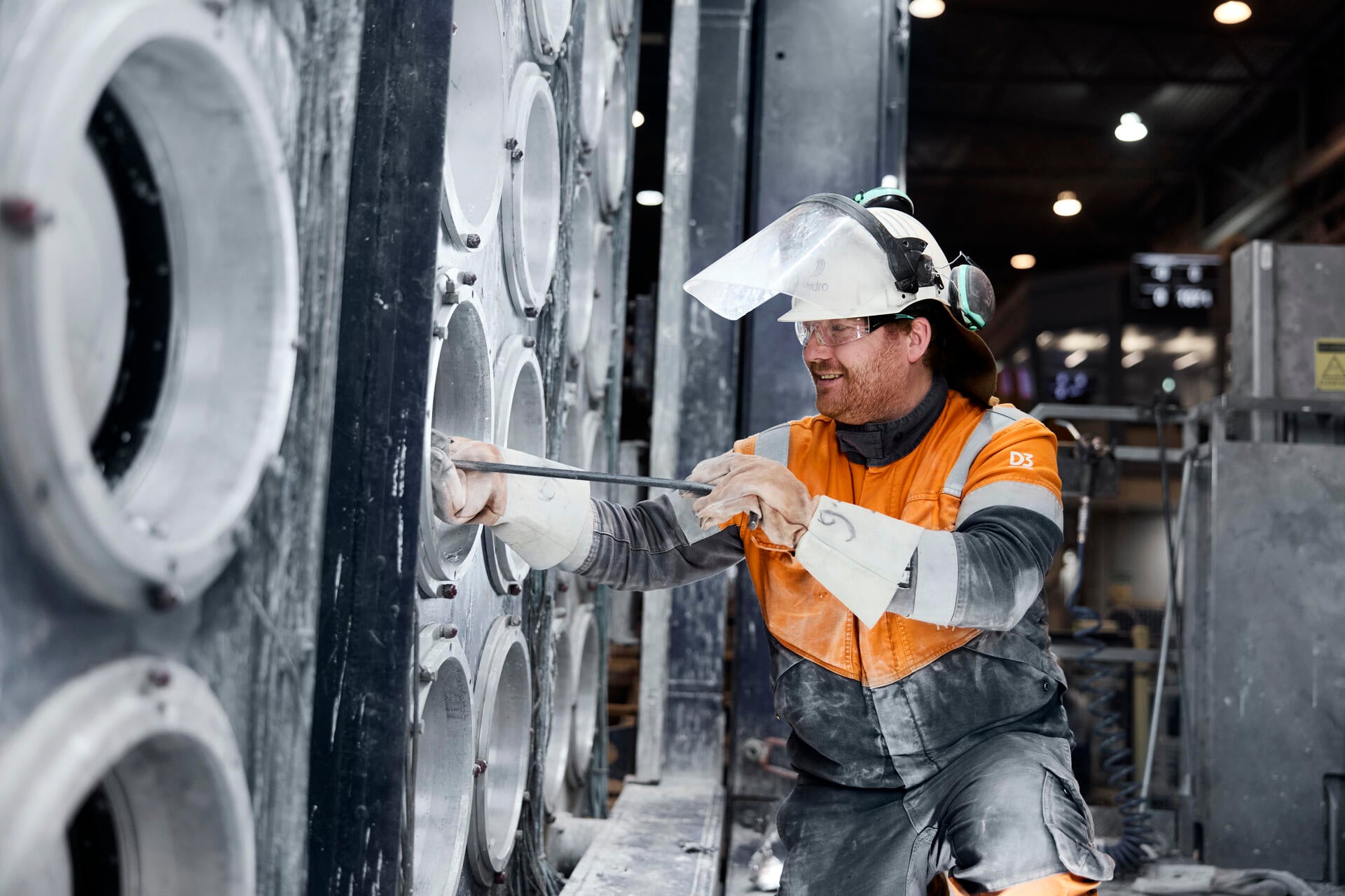a man wearing a hard hat and safety gear