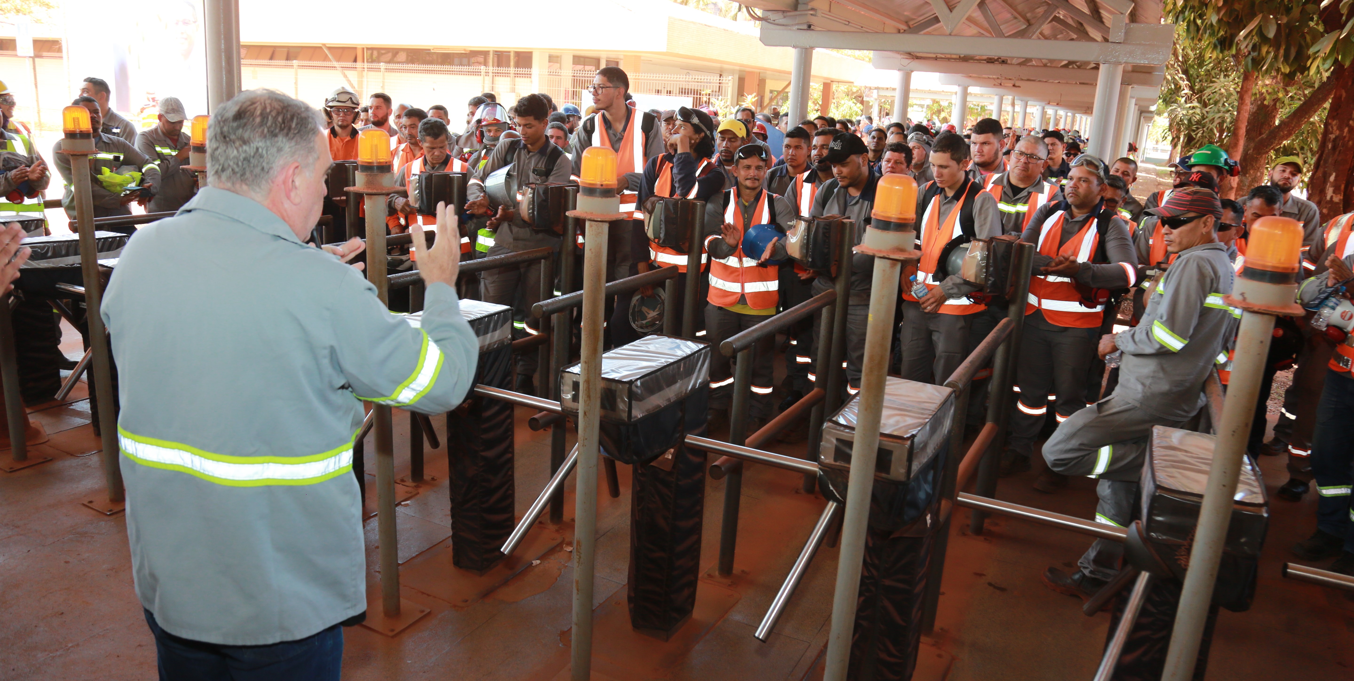 a person standing in front of a group of people in clothing
