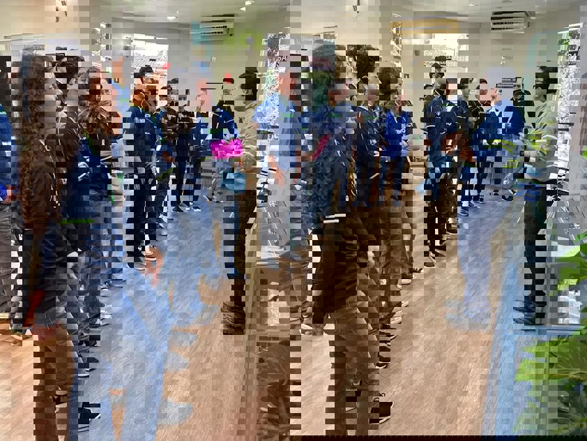 a group of people standing in a room