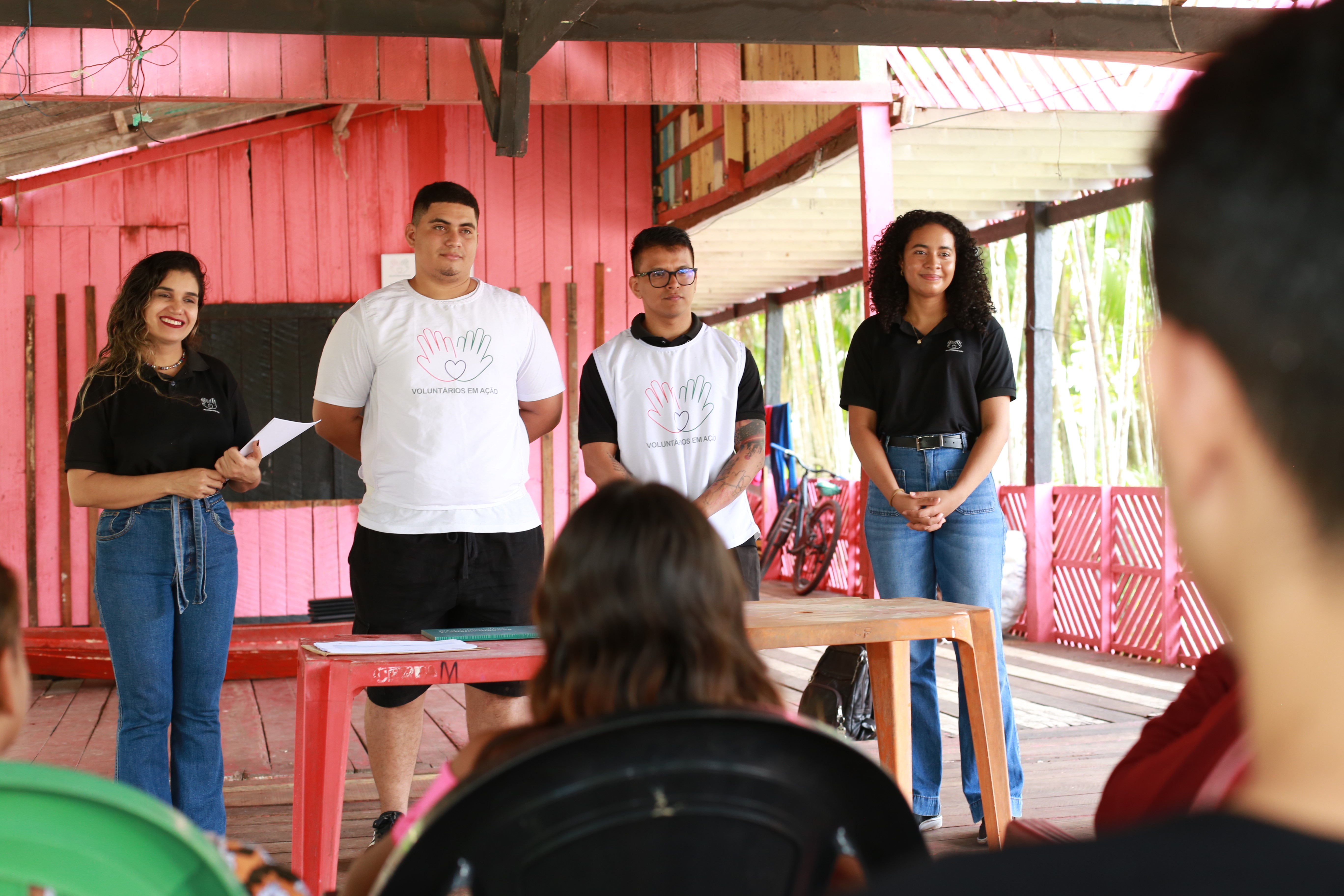 a group of people standing in a room