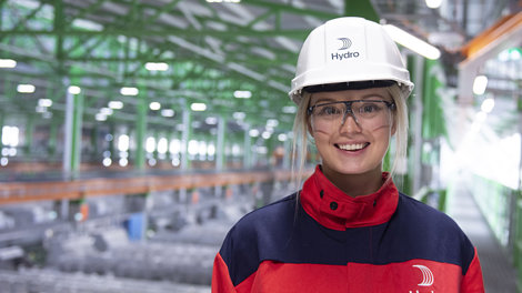 female worker in protective gear on factor floor