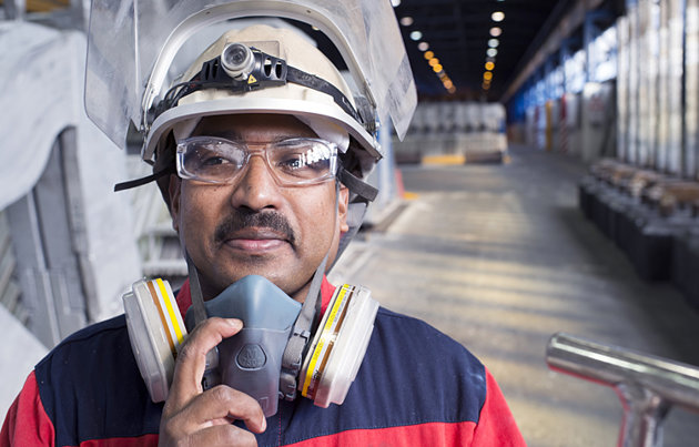 male worker in protective gear on factor floor male worker in protective gear on factor floor