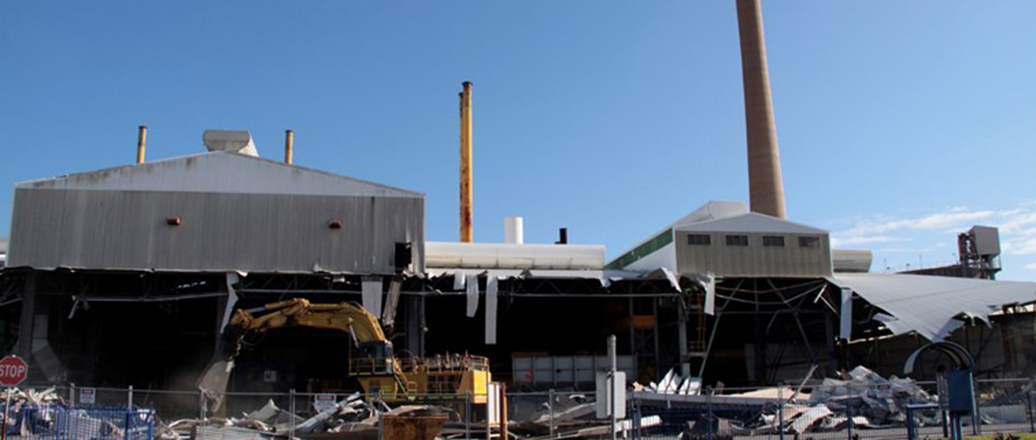 Exterior of factory buildings being demolished