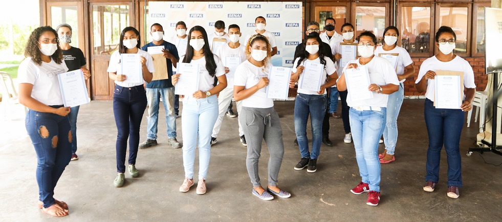 a group of people holding papers