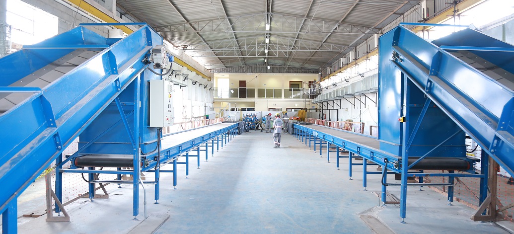 a large room with blue and white machinery