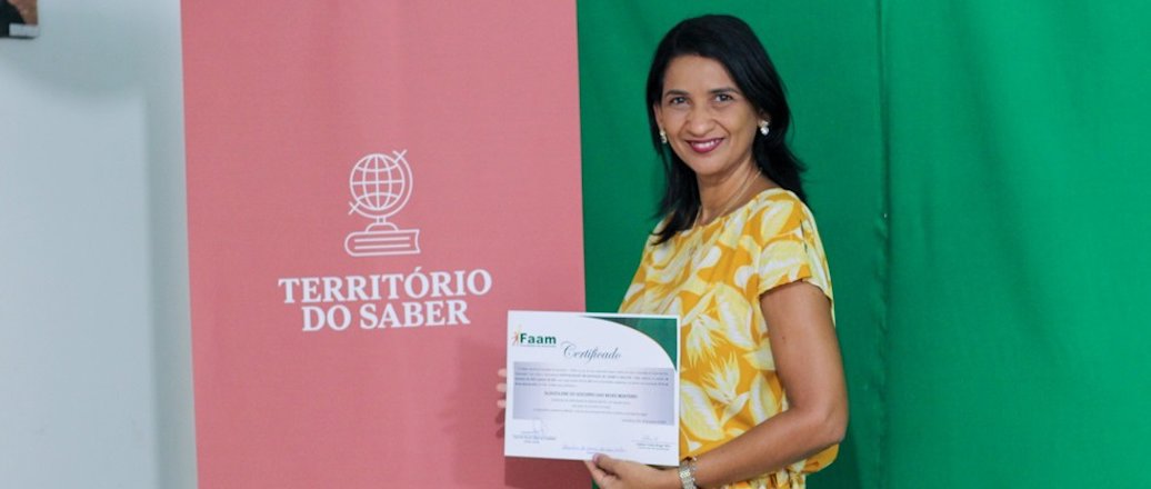 a woman holding a certificate
