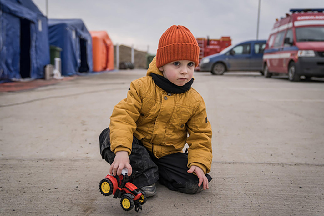 Child with toy tractor in Ukraine. Photo credit: UNICEF/Moldovan