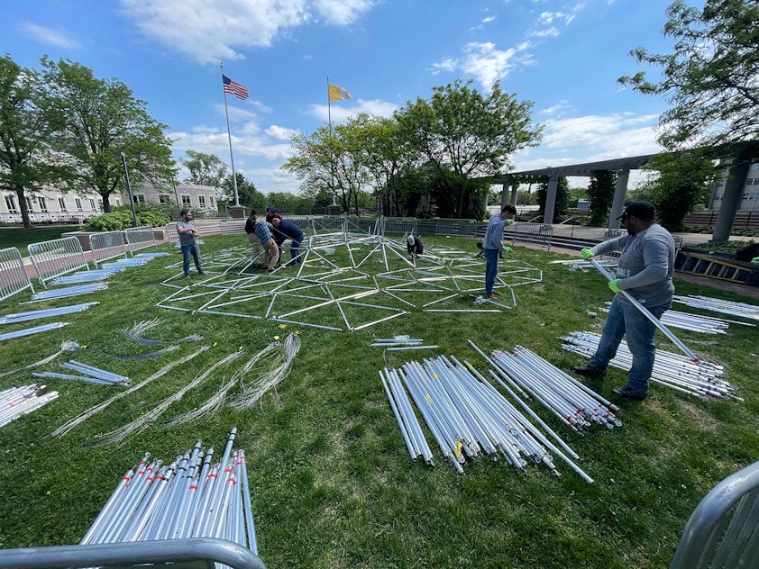 a group of people working in a field