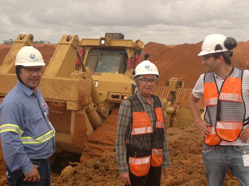 a group of people wearing hardhats and reflectors